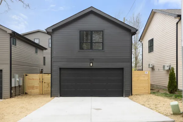 a front view of a house with a garage