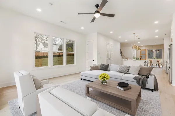 a living room with furniture and a large window