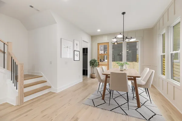a view of a dining room with furniture window and wooden floor