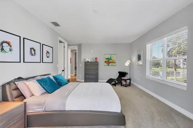 a view of a patio with iron fence