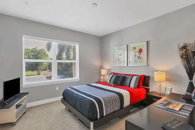a bathroom with a toilet sink vanity and mirror