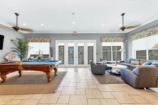 a view of a swimming pool with a table and chairs