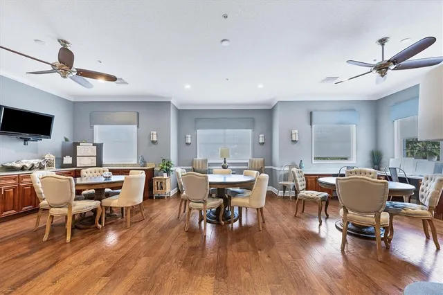 a view of a house with pool and sitting area