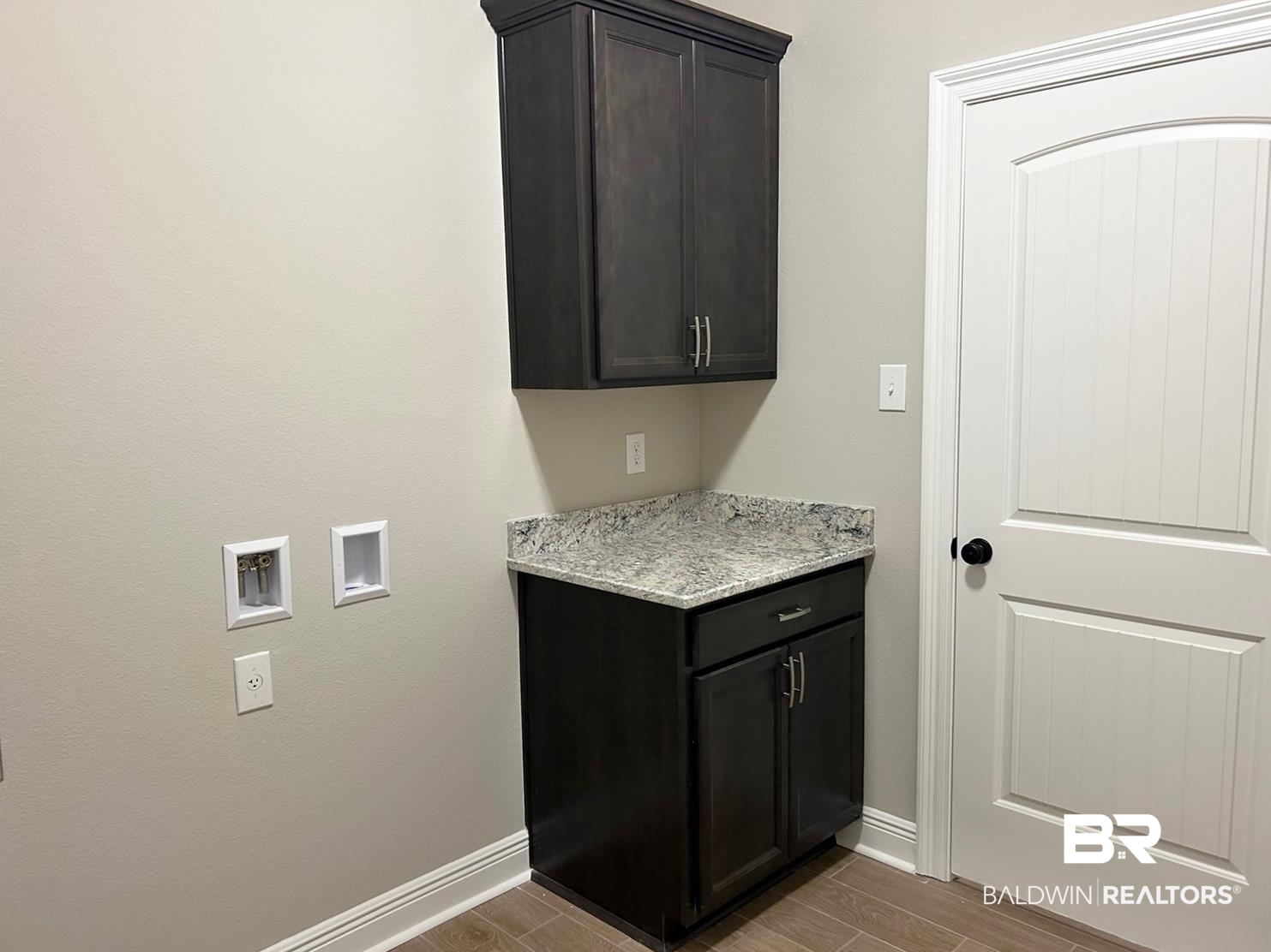 848 Sumter Loop Foley, AL 36535 - Photo 10 of 16 Clothes washing area featuring cabinets, hookup for a washing machine, and wood-type flooring