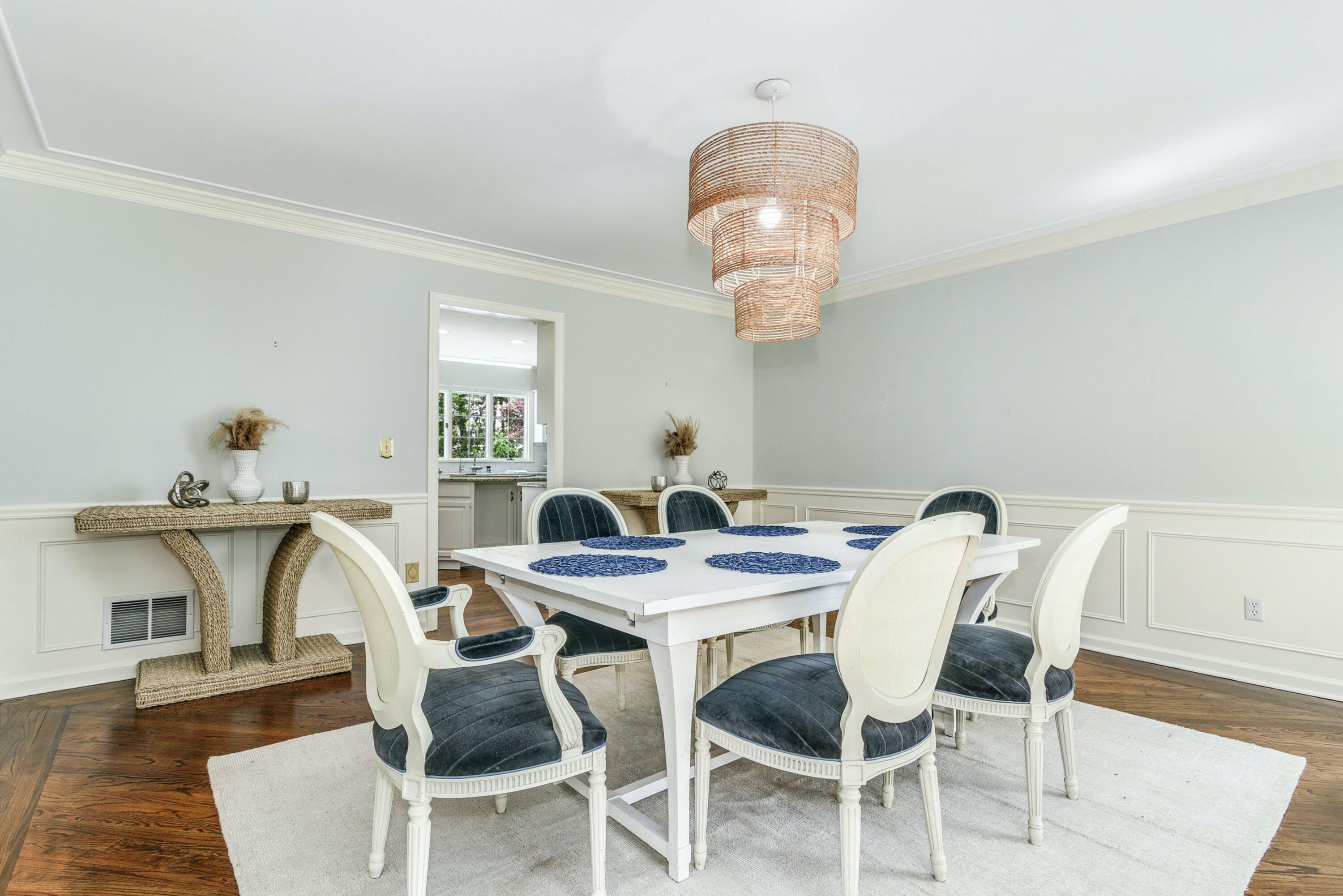 220 Old Norwalk Road New Canaan, CT 06840 - Photo 15 of 36 a view of a dining room with furniture wooden floor and chandelier