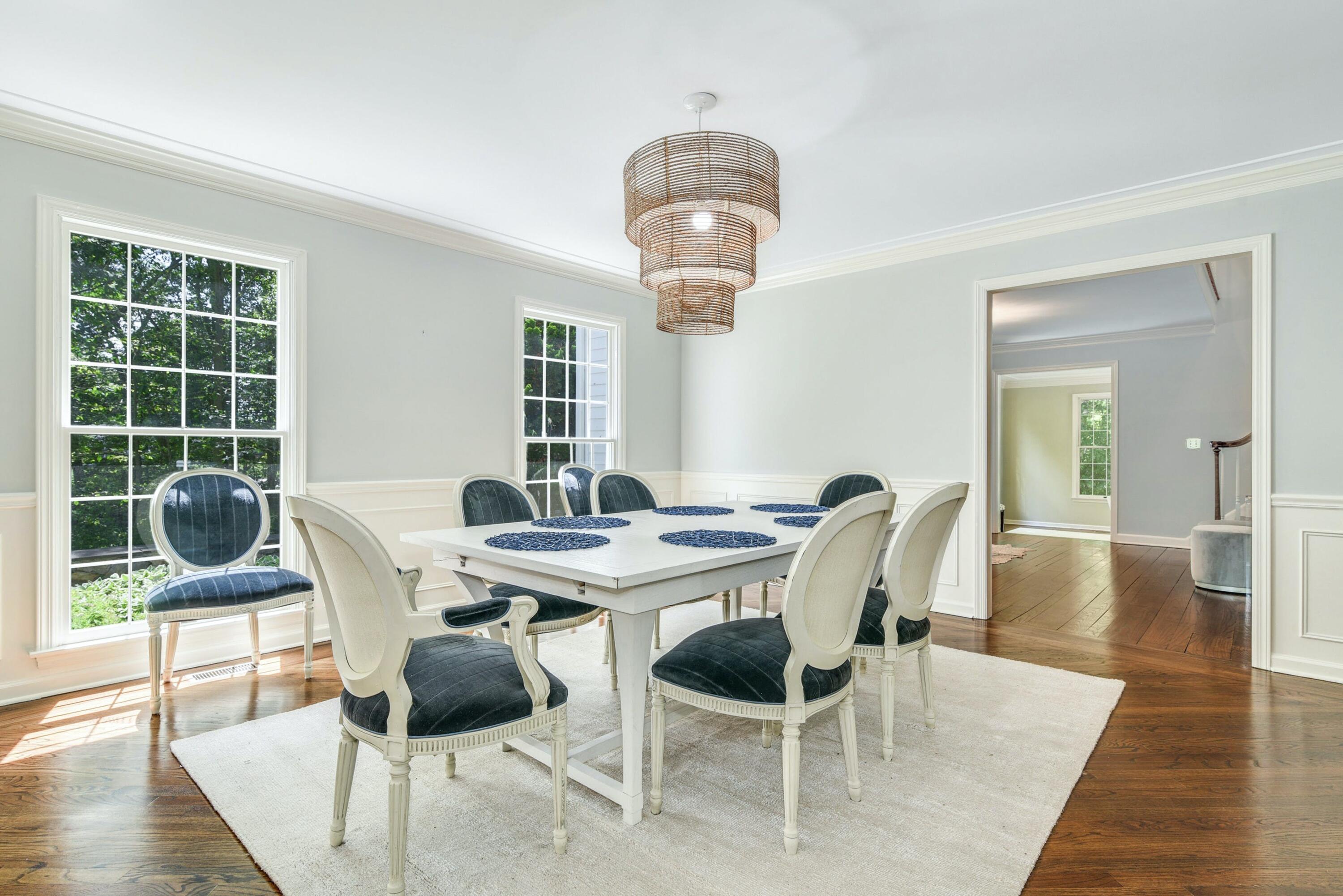 220 Old Norwalk Road New Canaan, CT 06840 - Photo 16 of 36 a view of a dining room with furniture wooden floor and chandelier