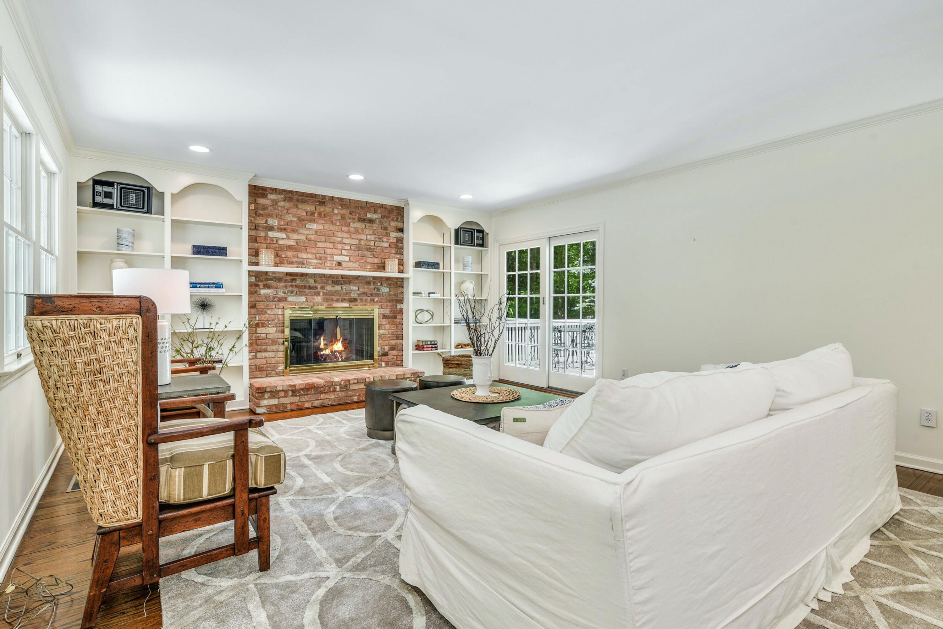 220 Old Norwalk Road New Canaan, CT 06840 - Photo 18 of 36 a living room with furniture and a fireplace