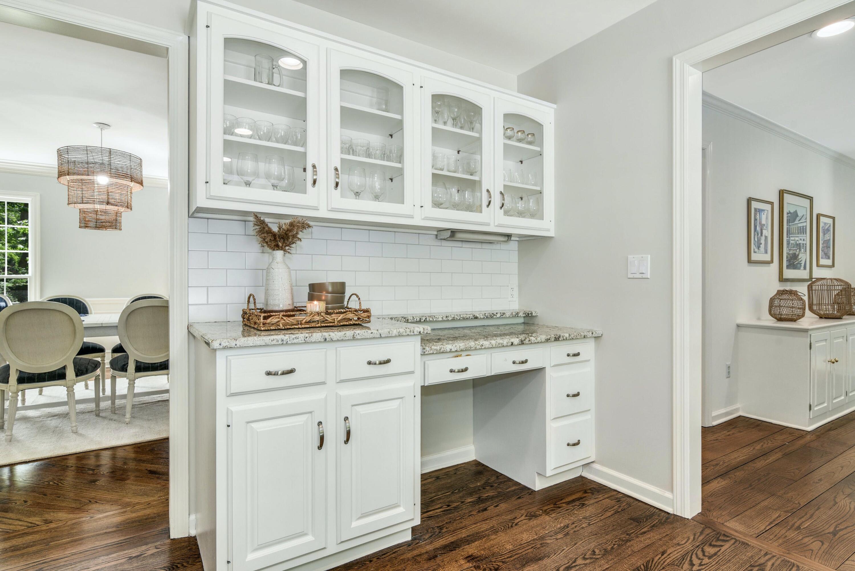 220 Old Norwalk Road New Canaan, CT 06840 - Photo 19 of 36 a kitchen with stainless steel appliances cabinets a stove and a dining table with wooden floor