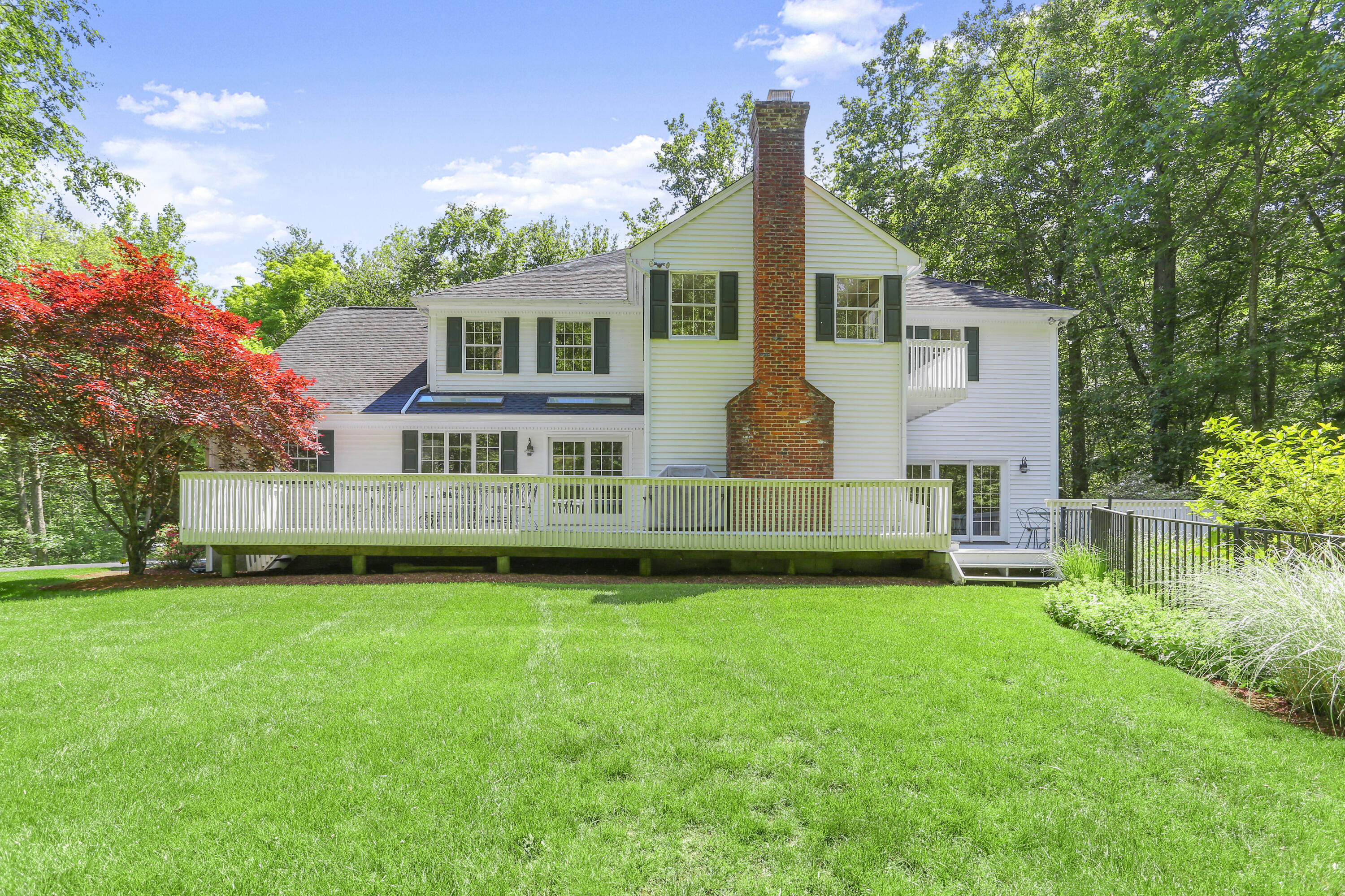 220 Old Norwalk Road New Canaan, CT 06840 - Photo 2 of 36 a front view of house with yard and green space
