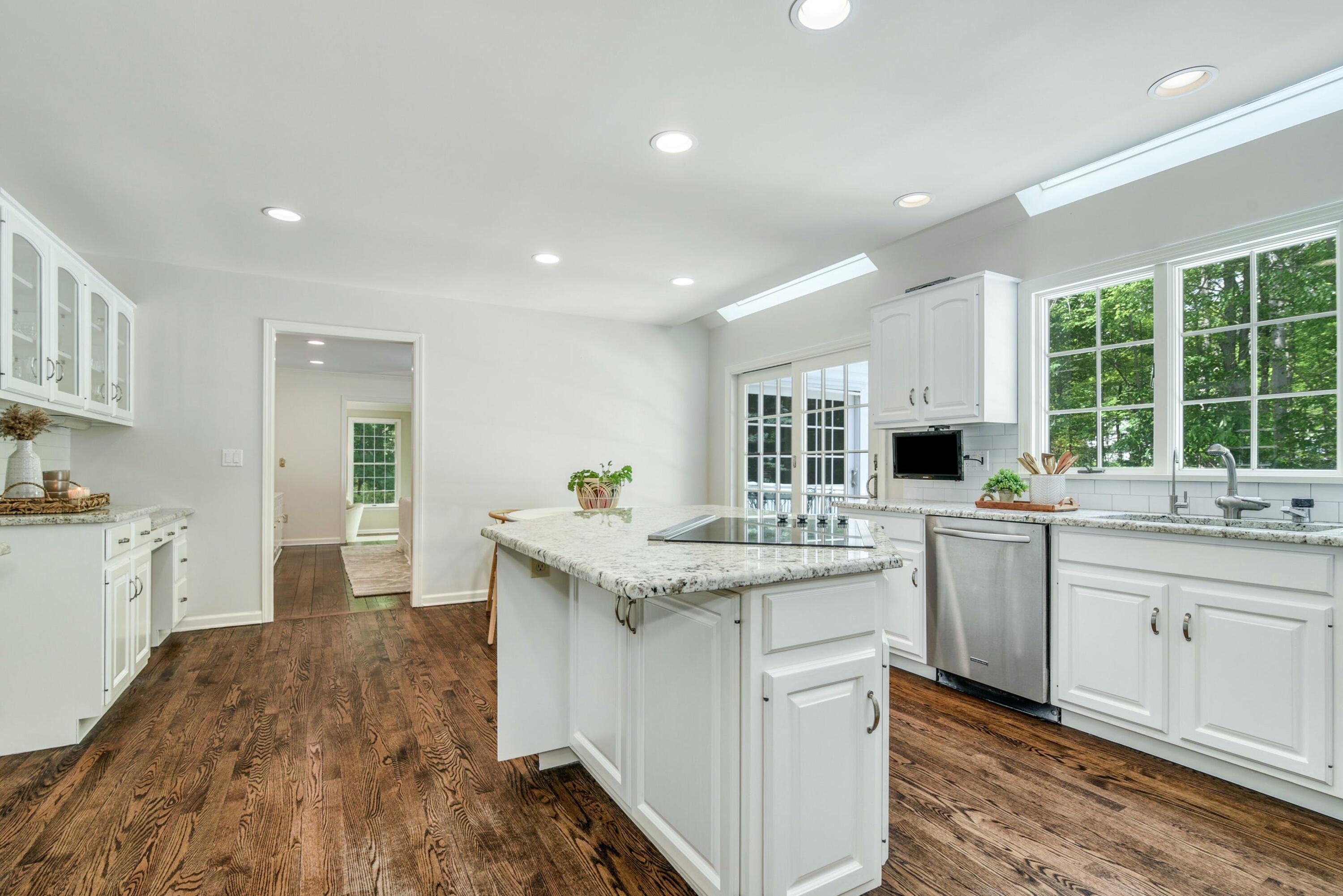 220 Old Norwalk Road New Canaan, CT 06840 - Photo 21 of 36 a kitchen with a sink stove and cabinets