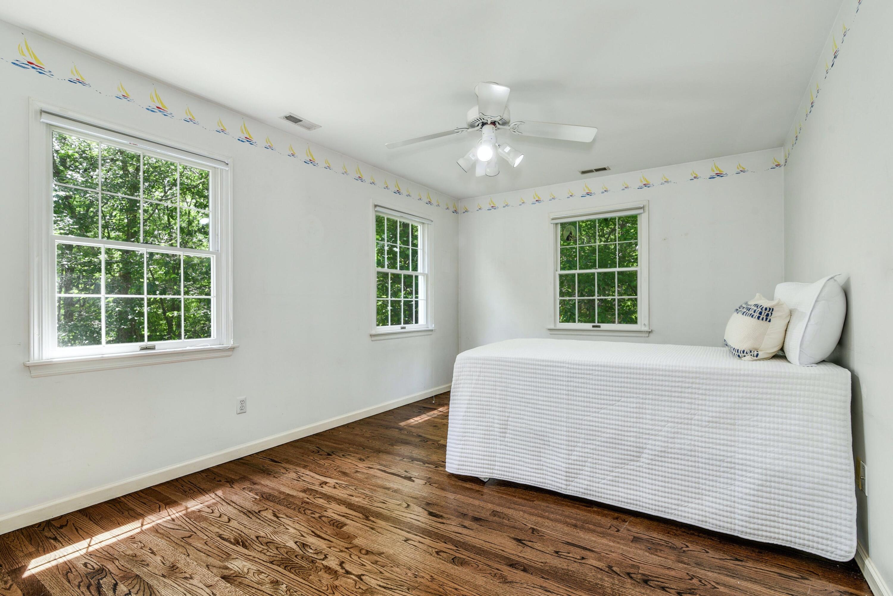 220 Old Norwalk Road New Canaan, CT 06840 - Photo 28 of 36 a bedroom with a bed and windows