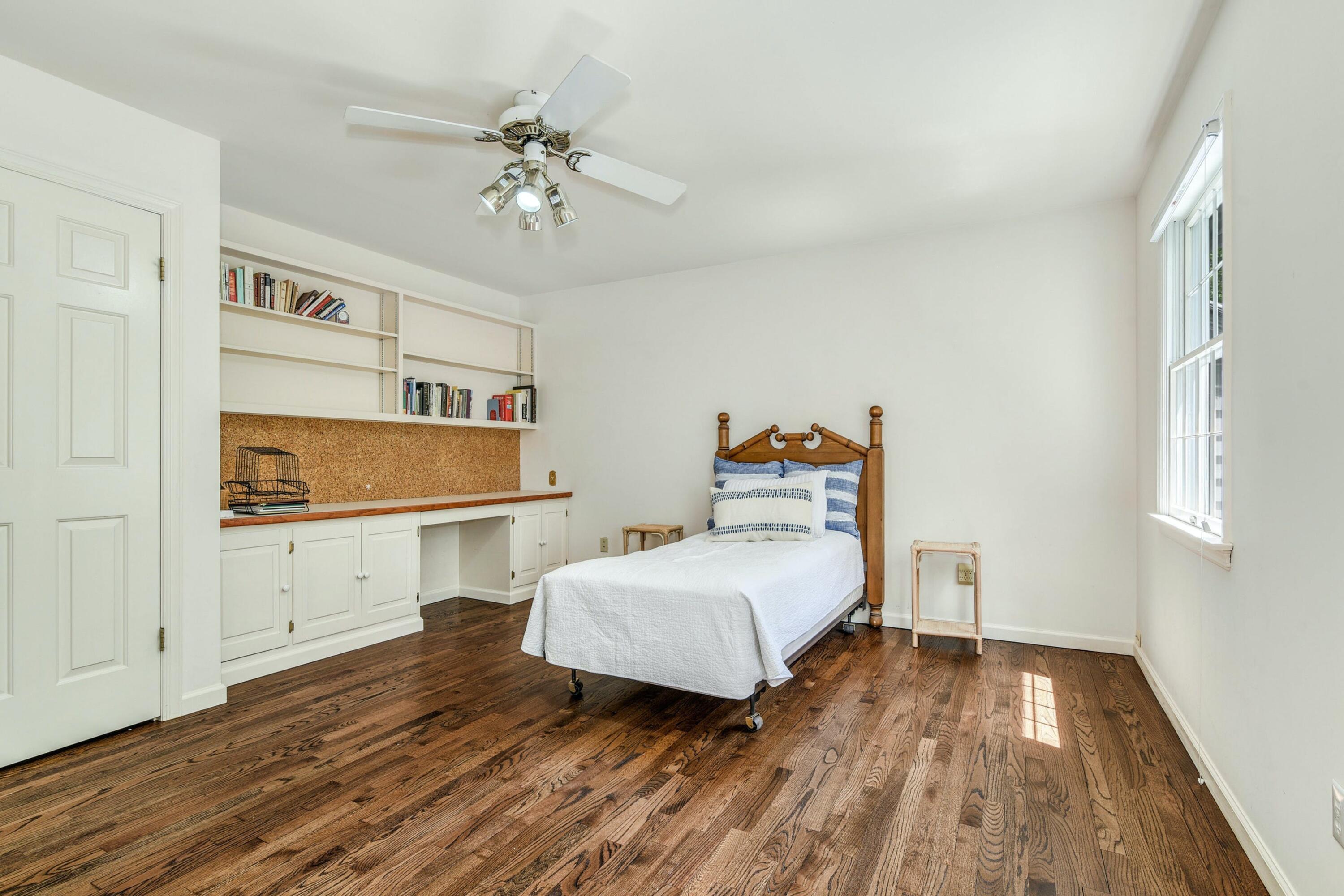 220 Old Norwalk Road New Canaan, CT 06840 - Photo 29 of 36 a bedroom with a bed and a chandelier