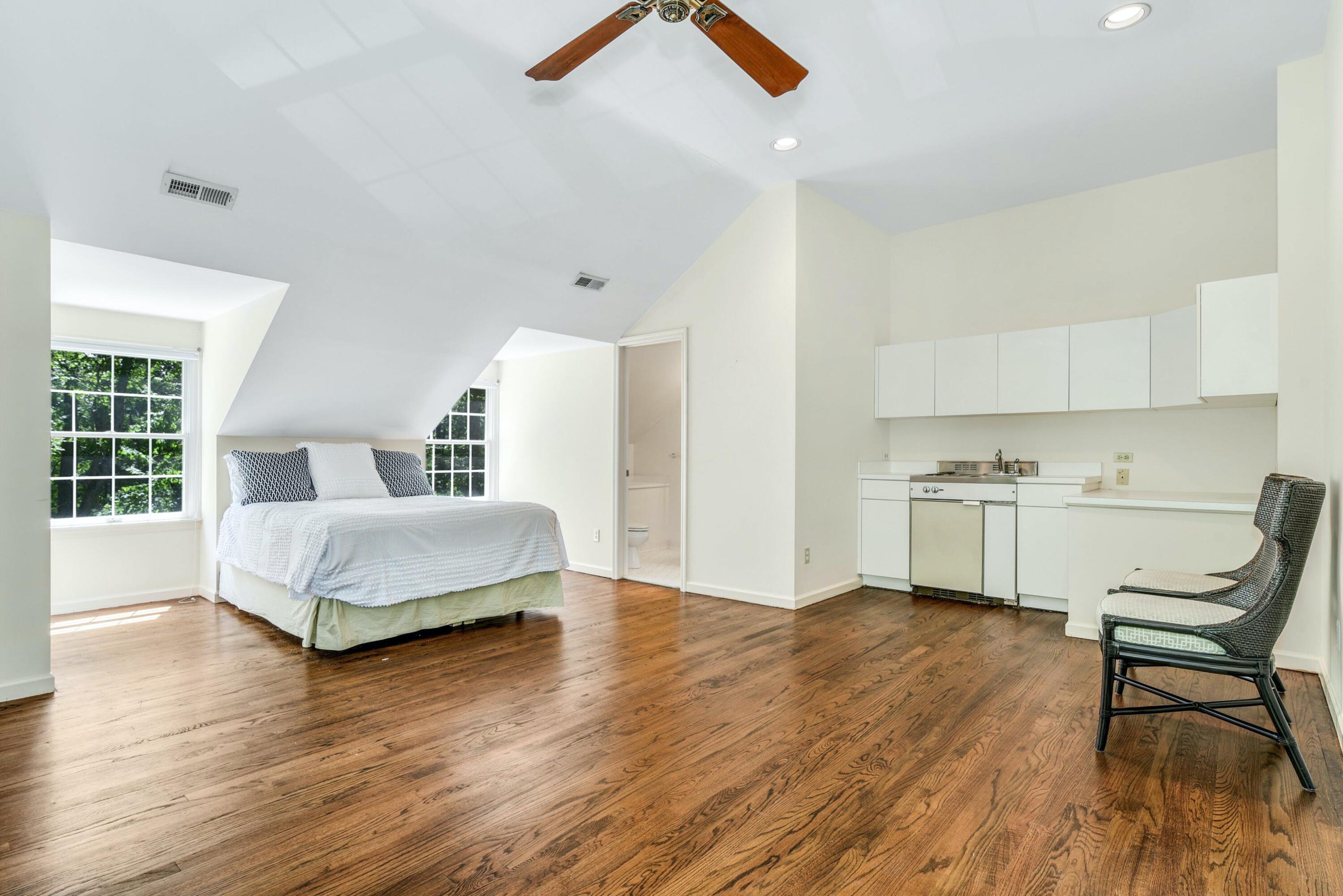 220 Old Norwalk Road New Canaan, CT 06840 - Photo 32 of 36 a bedroom with a bed and a table chair