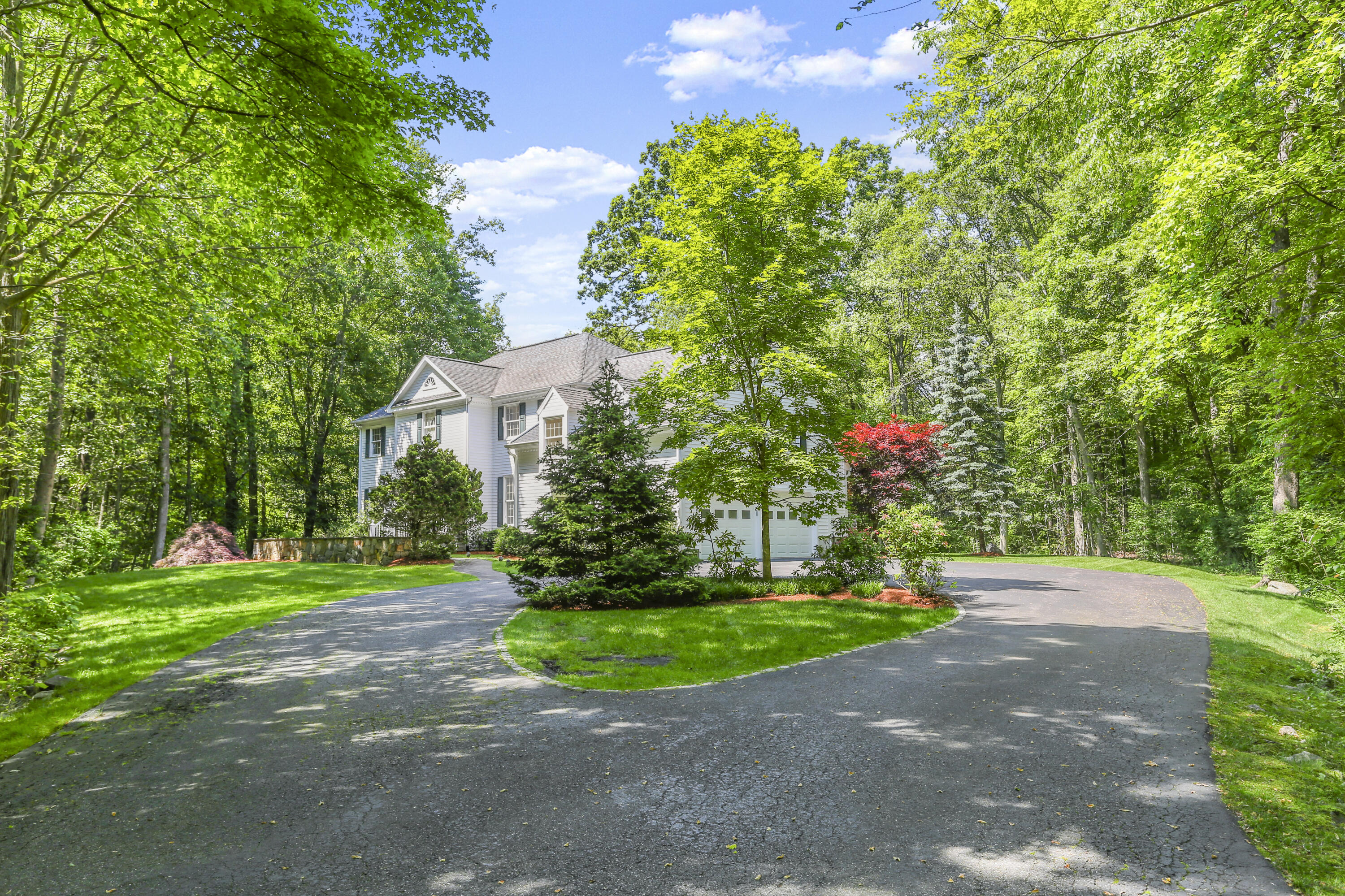 220 Old Norwalk Road New Canaan, CT 06840 - Photo 5 of 36 a view of a park with a house in the background