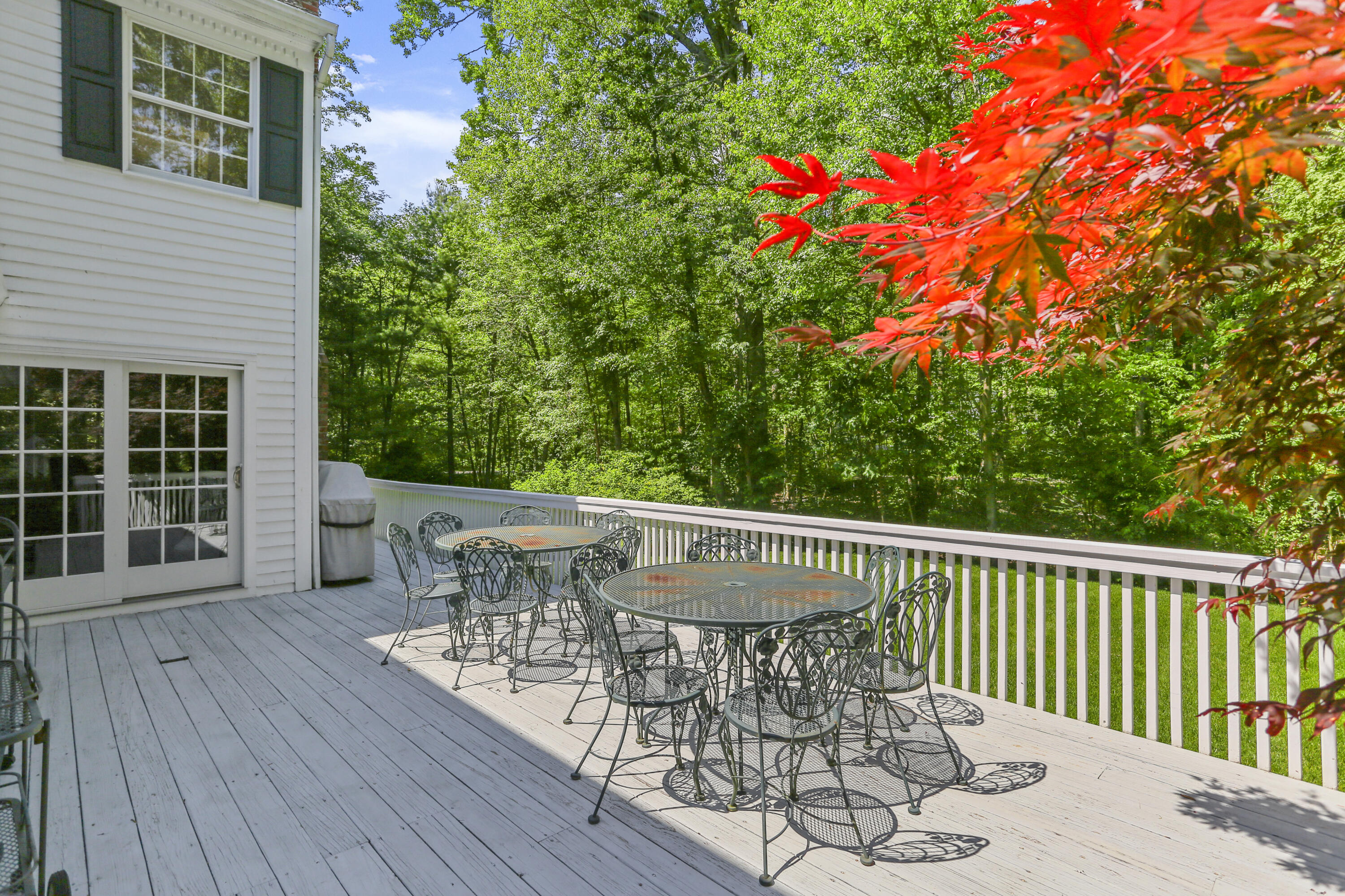 220 Old Norwalk Road New Canaan, CT 06840 - Photo 7 of 36 a roof deck with table and chairs and wooden floor