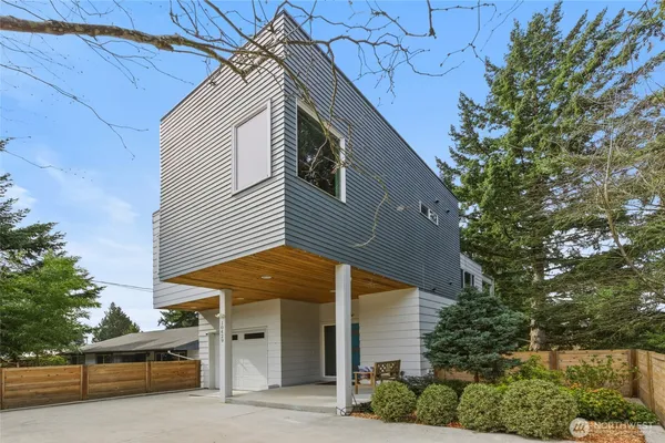 a front view of a house with garage