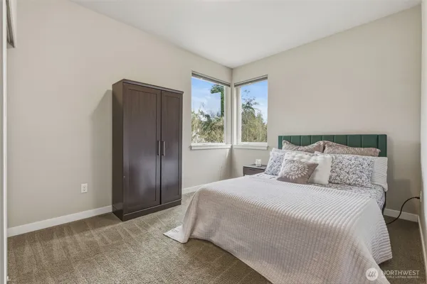 a bedroom with bed and a window