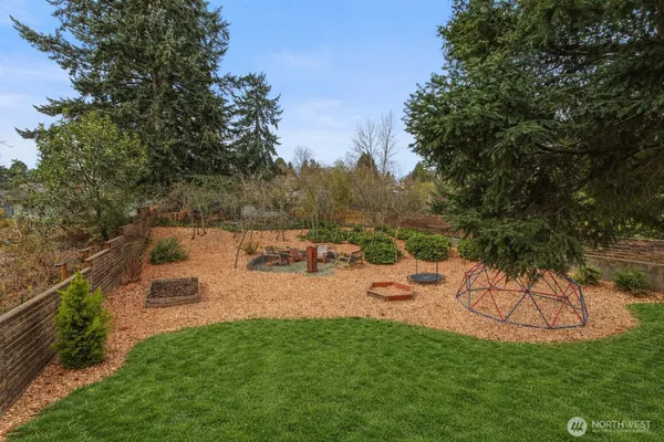 a view of a backyard with sitting area