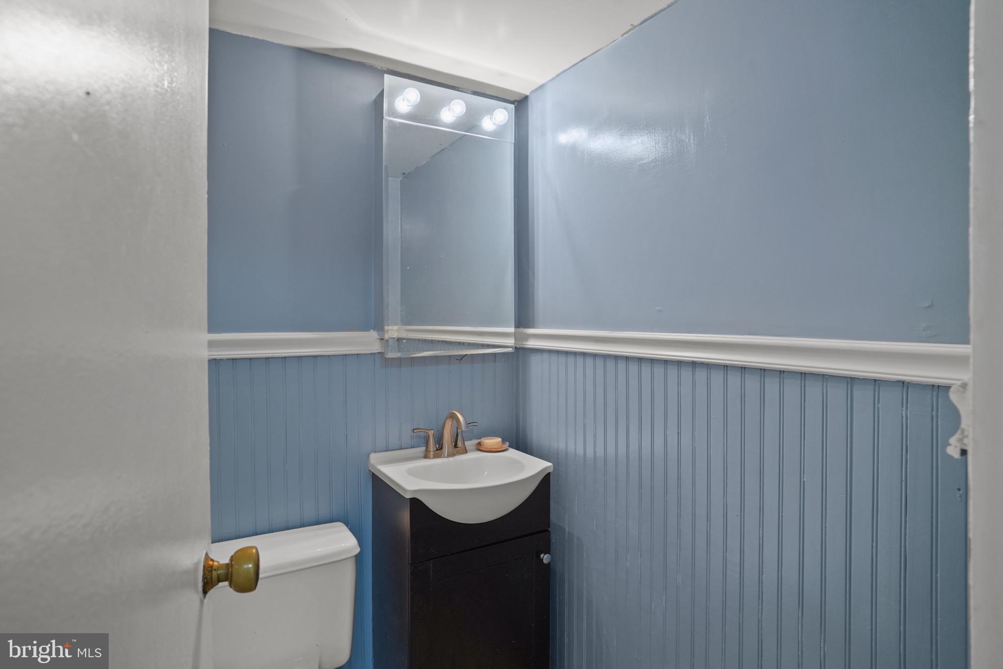 1801 Clydesdale Place Northwest, Unit 420 Washington, DC 20009 - Photo 17 of 33 a bathroom with a sink and mirror