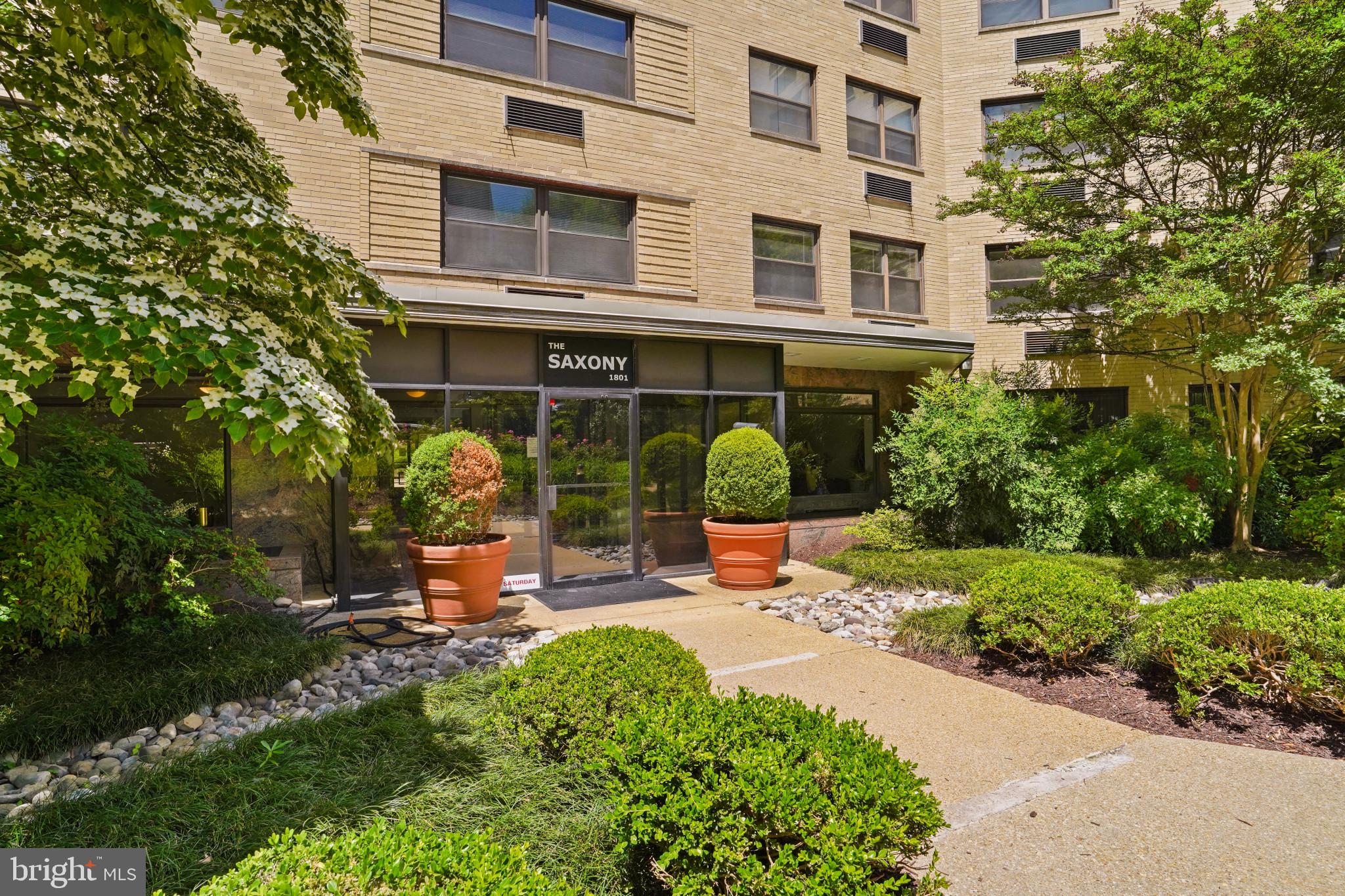 1801 Clydesdale Place Northwest, Unit 420 Washington, DC 20009 - Photo 2 of 33 a view of a building with sitting area and garden