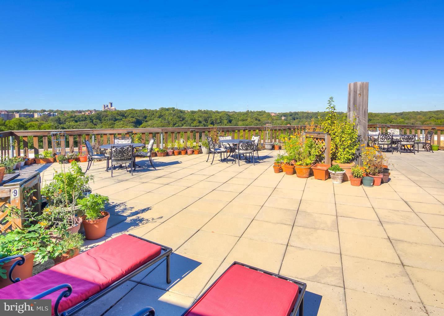 1801 Clydesdale Place Northwest, Unit 420 Washington, DC 20009 - Photo 24 of 33 a view of swimming pool with a table and chairs