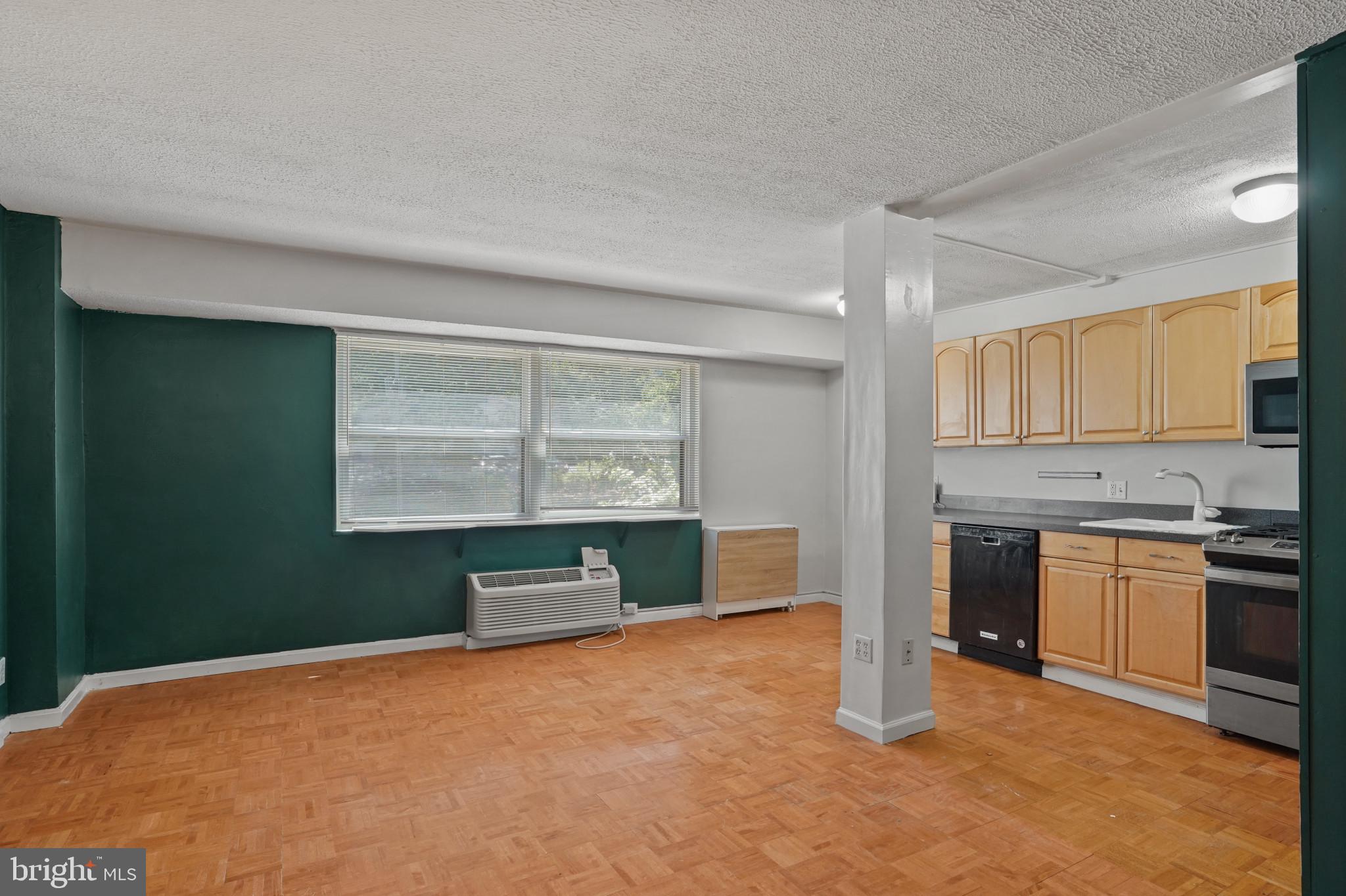 1801 Clydesdale Place Northwest, Unit 420 Washington, DC 20009 - Photo 6 of 33 a view of kitchen with granite countertop cabinets and stainless steel appliances