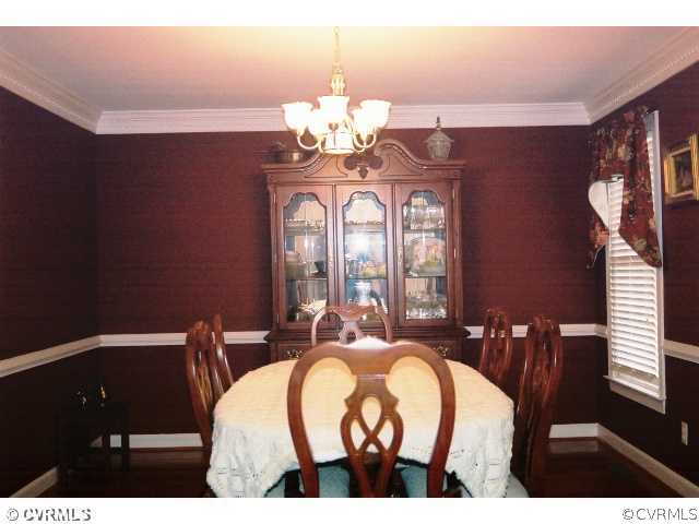 16775 Hudgins Road Dewitt, VA 23840 - Photo 5 of 11 a view of a dining room with furniture and chandelier