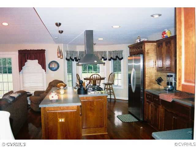 16775 Hudgins Road Dewitt, VA 23840 - Photo 8 of 11 a kitchen with refrigerator and cabinets