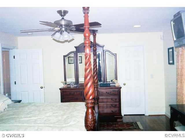 16775 Hudgins Road Dewitt, VA 23840 - Photo 10 of 11 a view of a hallway with wooden floor and staircase