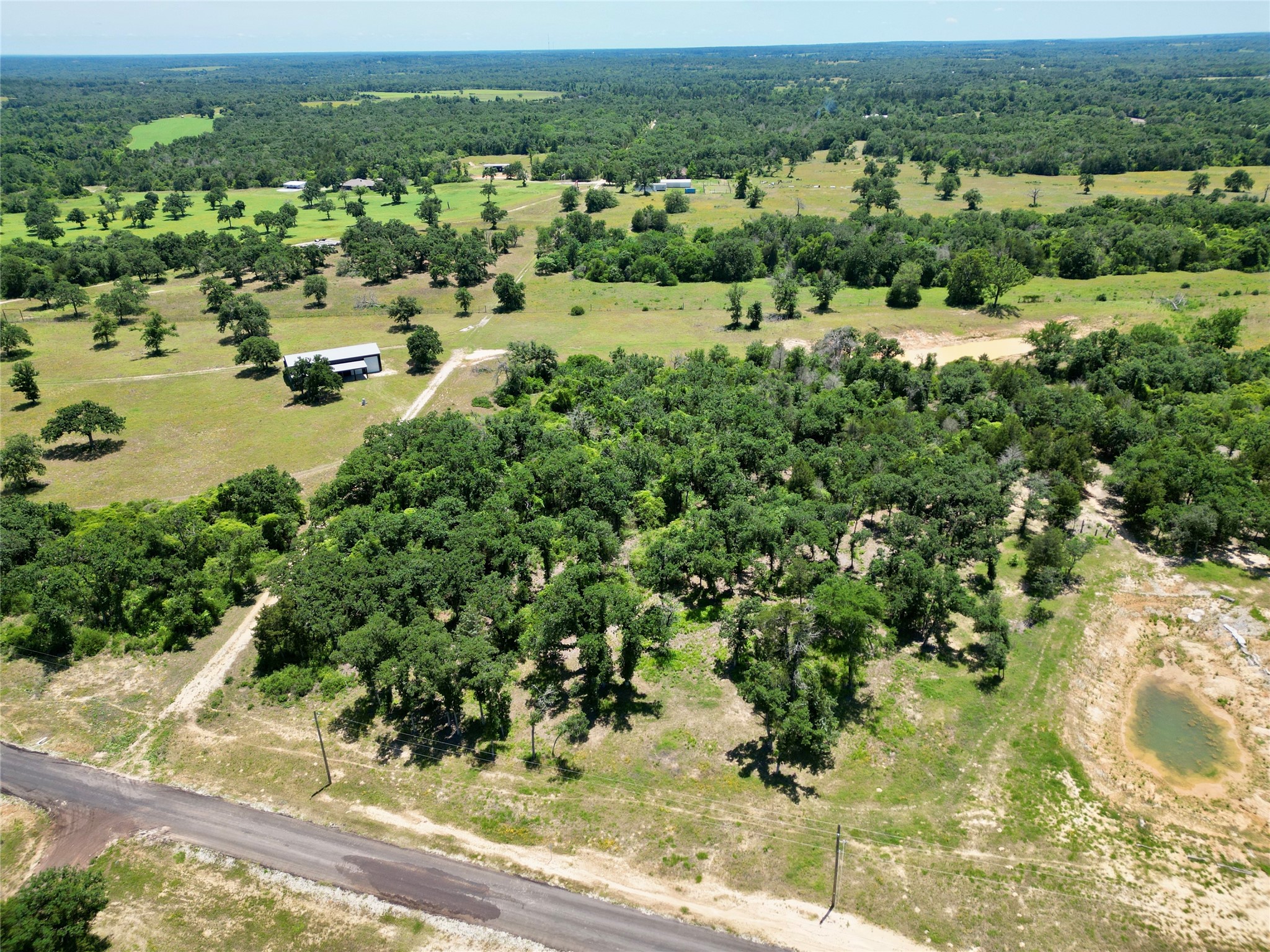 an aerial view of a houses with a yard