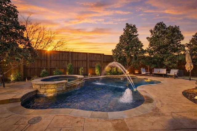 a view of a backyard with swimming pool