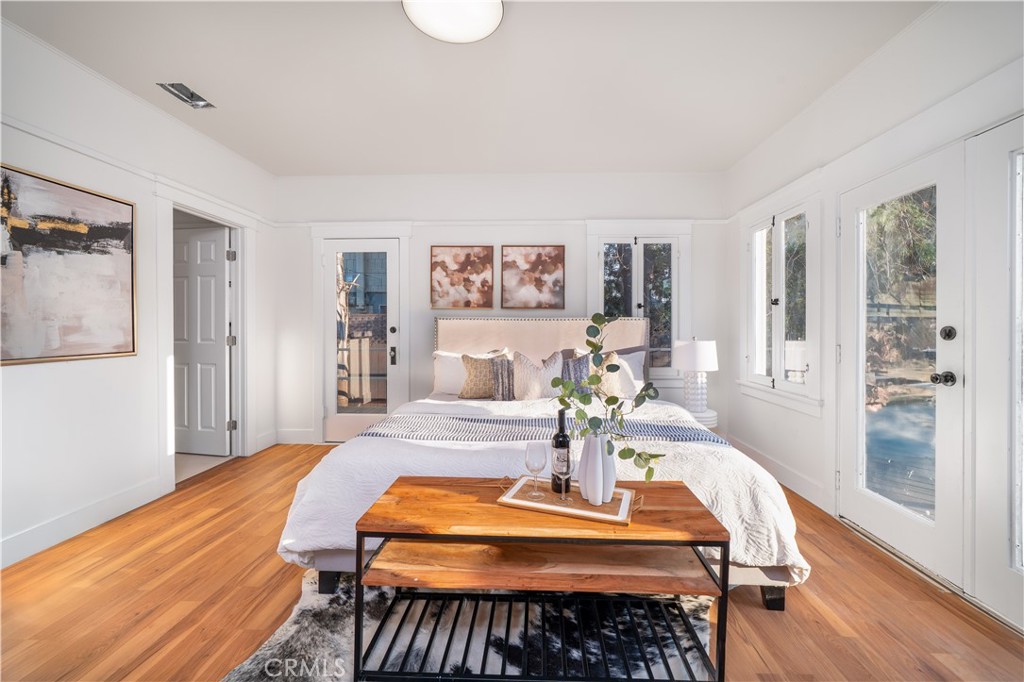 843 Cedar Avenue Long Beach, CA 90813 - Photo 13 of 42 a room with furniture and wooden floor