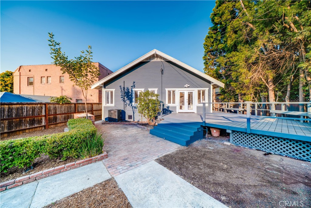 843 Cedar Avenue Long Beach, CA 90813 - Photo 23 of 42 a view of a house with wooden deck and furniture