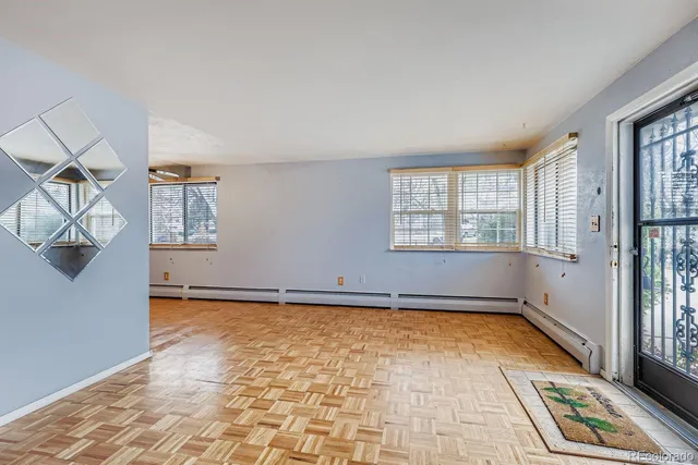 a view of an empty room with a window