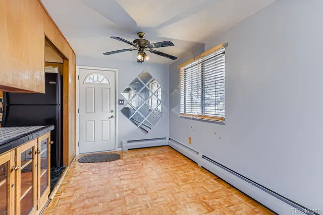 wooden floor in an empty room with a window