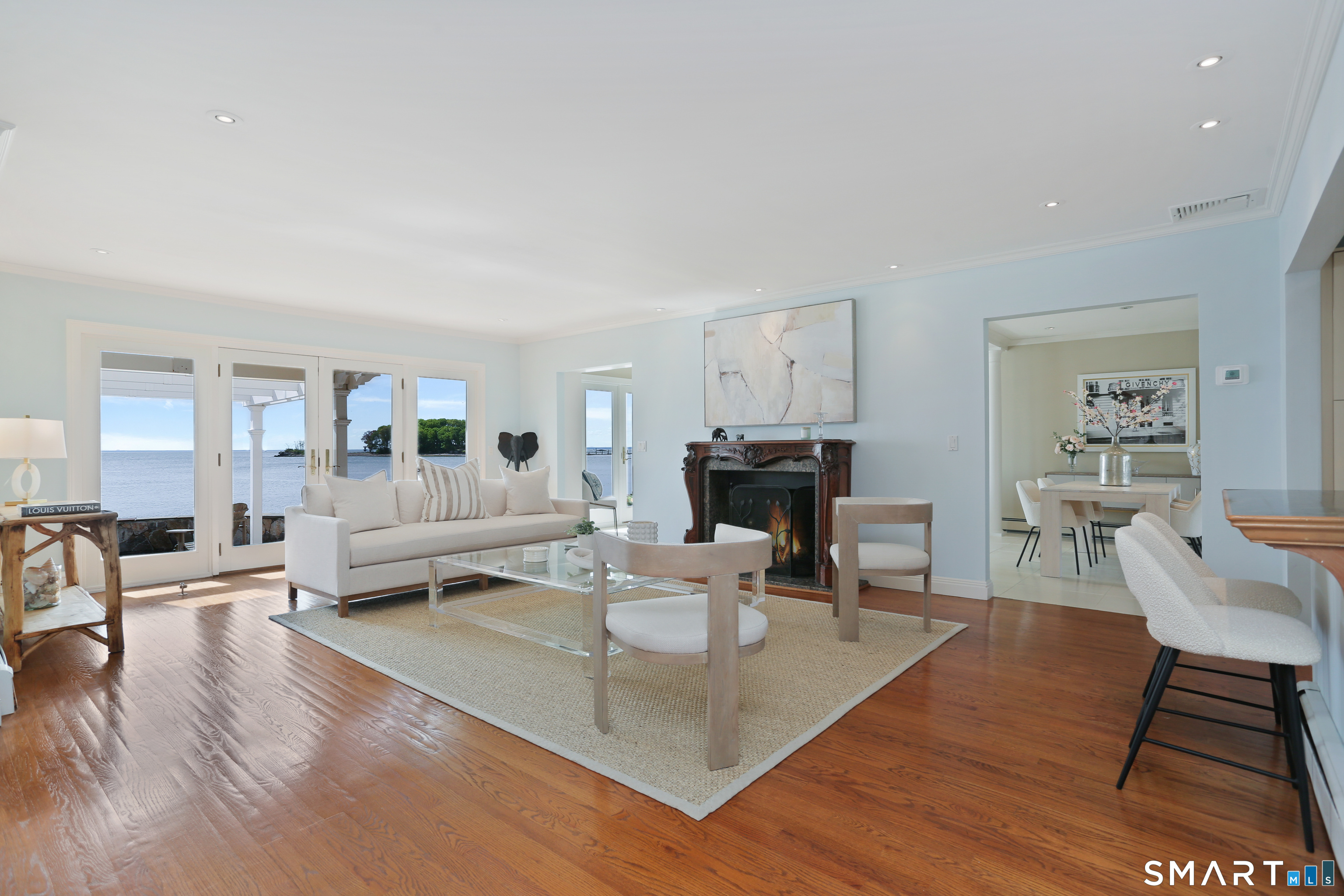 34 Shorehaven Road Norwalk, CT 06855 - Photo 14 of 40 a living room with fireplace furniture and a wooden floor