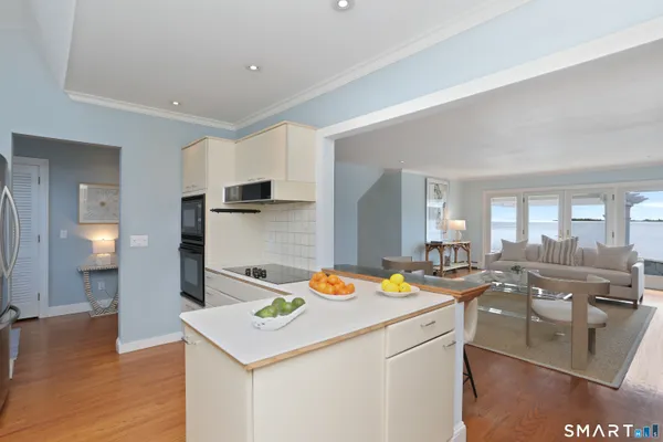 a kitchen that has a table and chairs