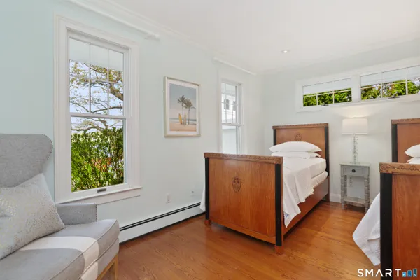 a bed room with a bed and a window