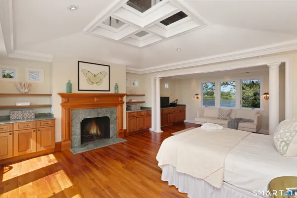 a bedroom with a bed and a fireplace