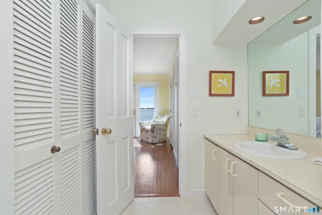 a en suite bathroom with a sink and a mirror