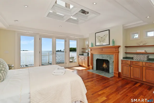 a bedroom with a bed and a fireplace