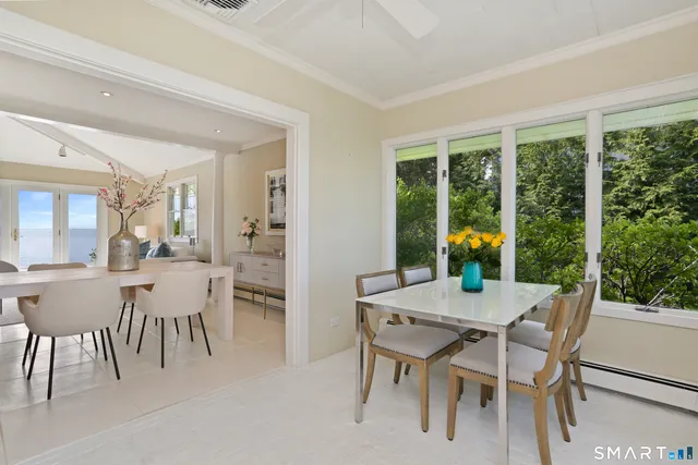 a view of a dining room with furniture and window