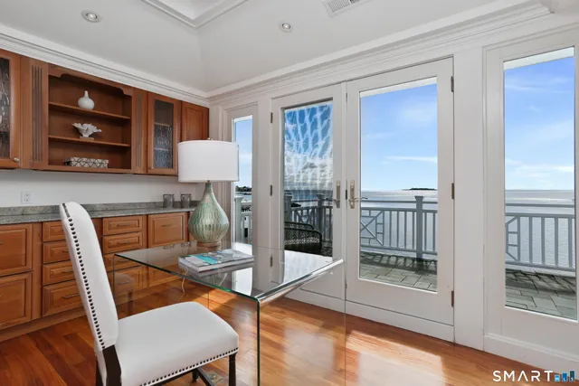 a dining room with furniture and wooden floor