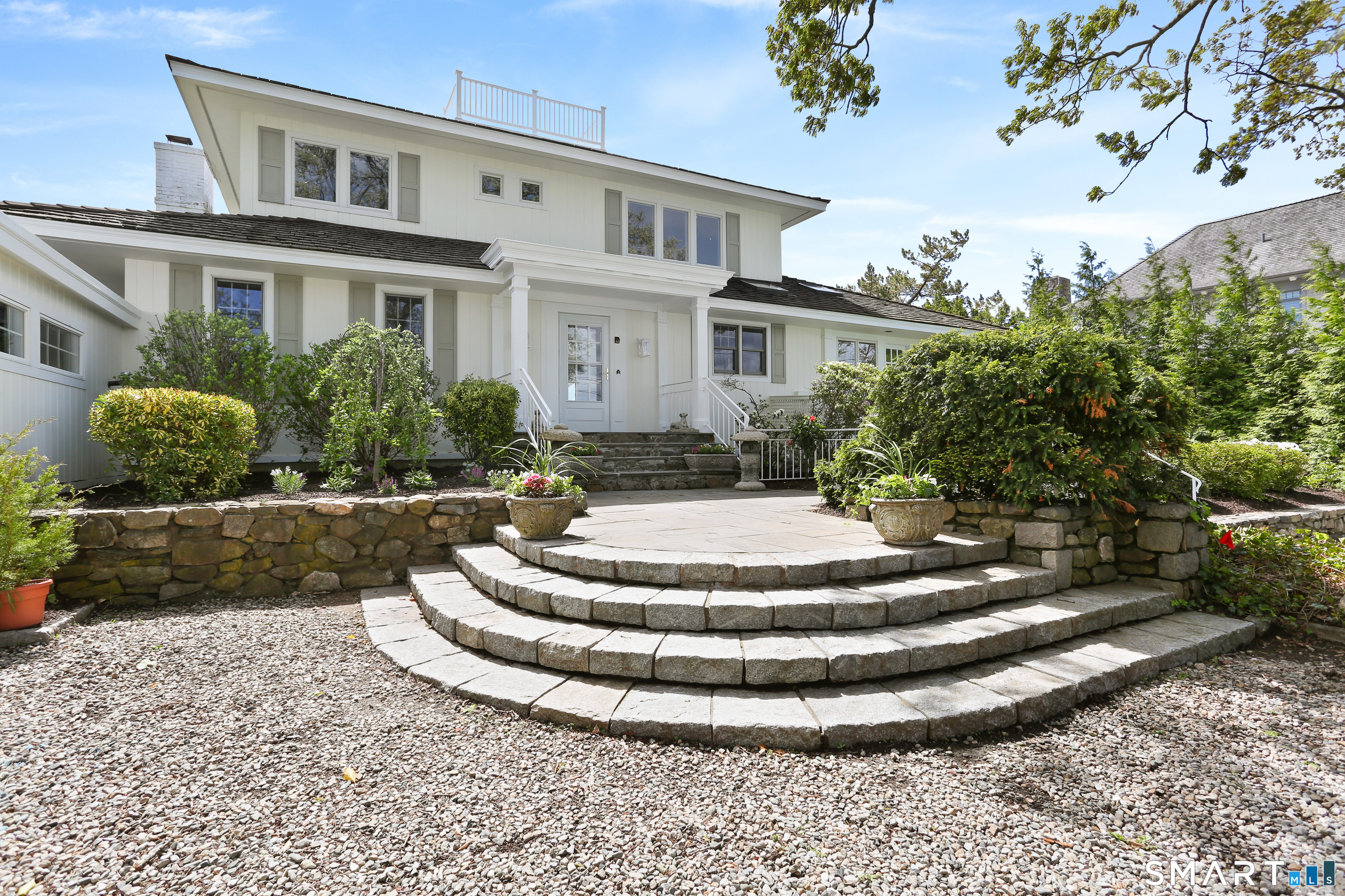 34 Shorehaven Road Norwalk, CT 06855 - Photo 10 of 40 a front view of a house with a yard