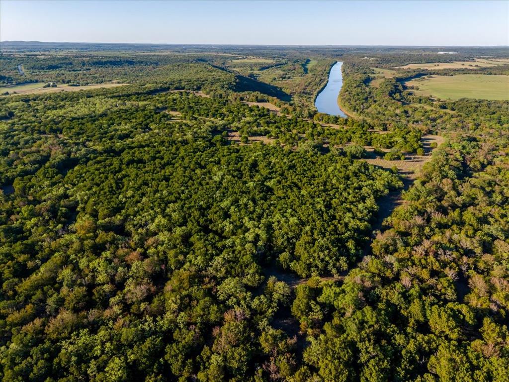 1674 Ming Bend Road Graham, TX 76450 - Photo 31 of 40 Expansive acreage featuring mature trees and a substantial water channel
