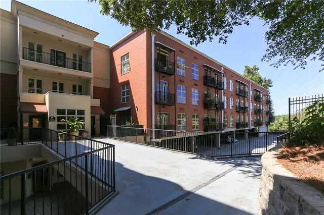 a building with table and chairs in front of it