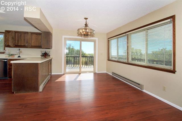 18790 Spring Valley Road Monument, CO 80132 - Photo 4 of 23 New flooring and new vinyl windows and slider