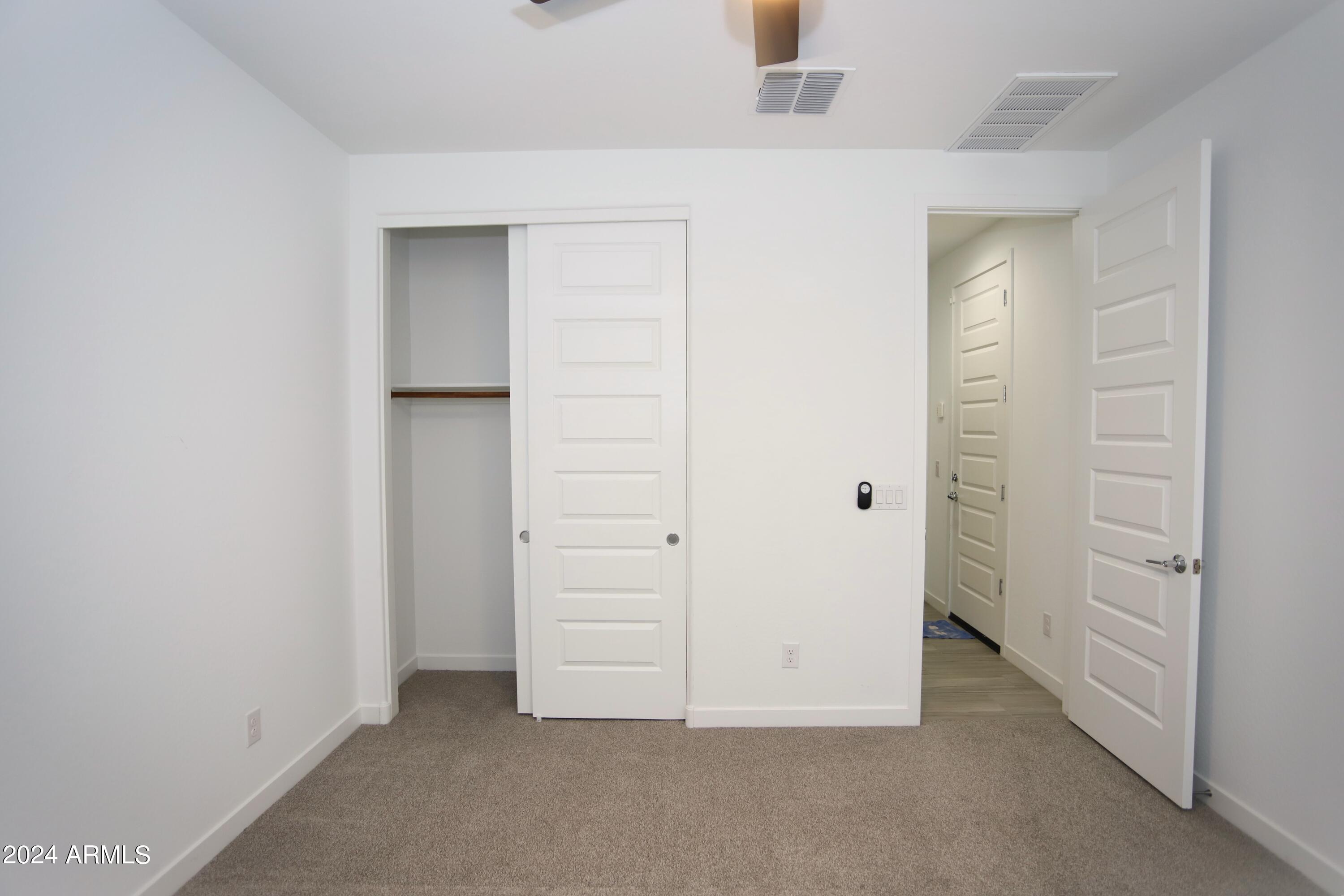1651 West Piedmont Road Phoenix, AZ 85041 - Photo 14 of 46 an empty room with closet