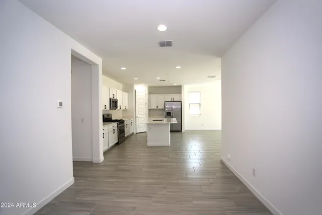 a view of a kitchen with wooden floor