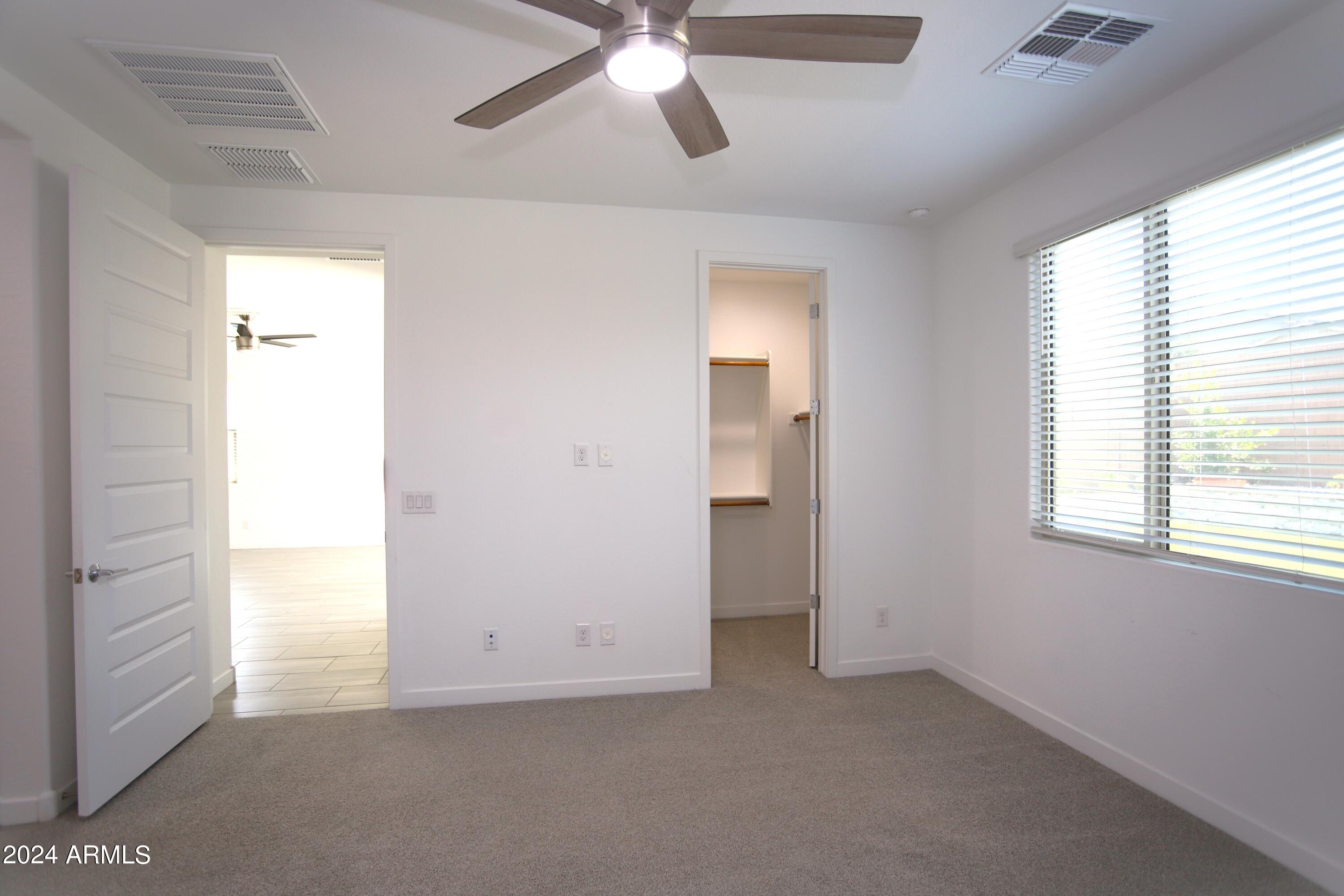 1651 West Piedmont Road Phoenix, AZ 85041 - Photo 27 of 46 a view of an empty room with a window